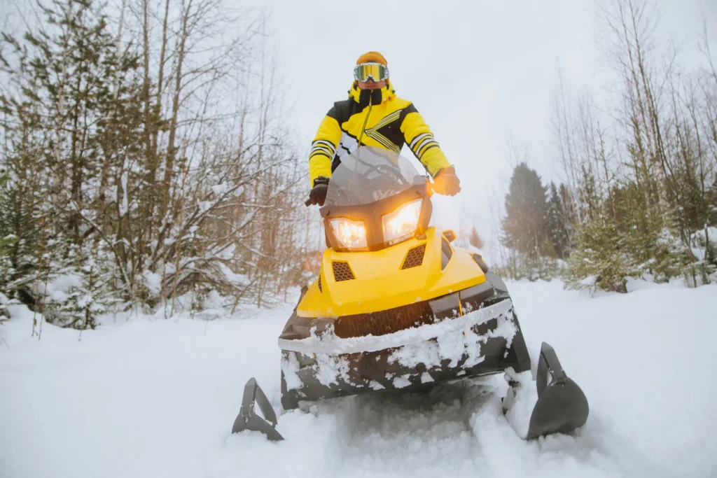 Man riding snowmobile