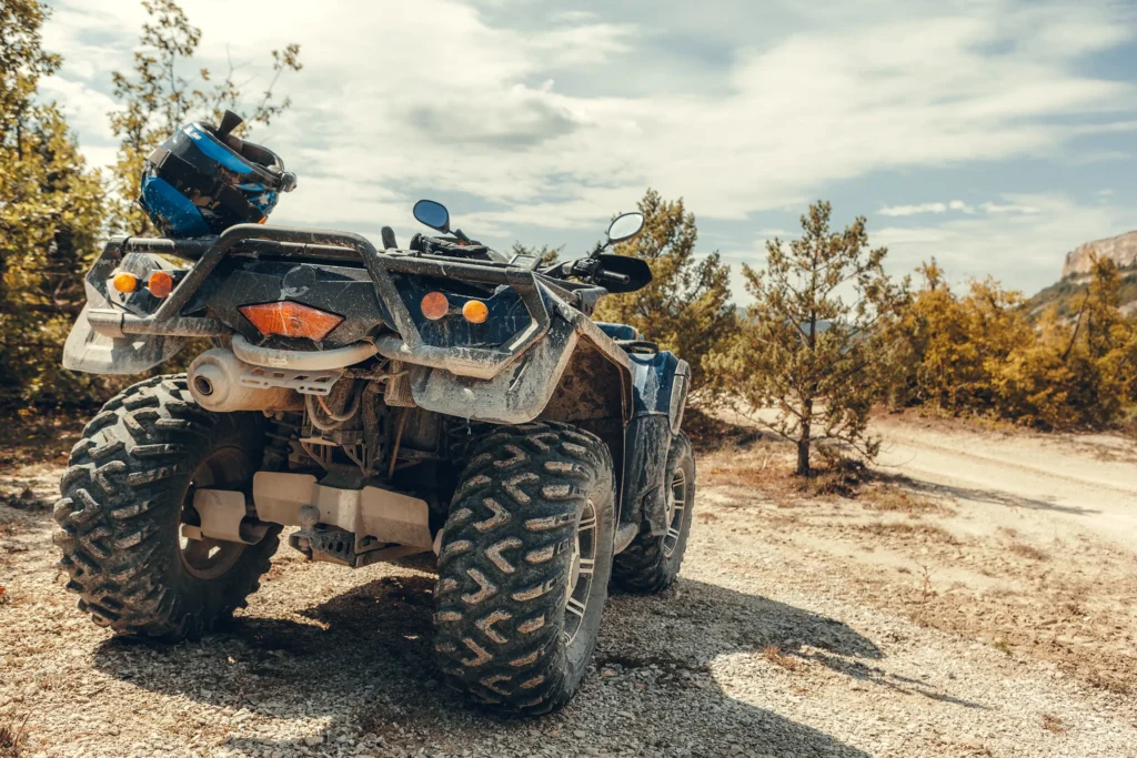 Close-up of the back of a muddy ATV