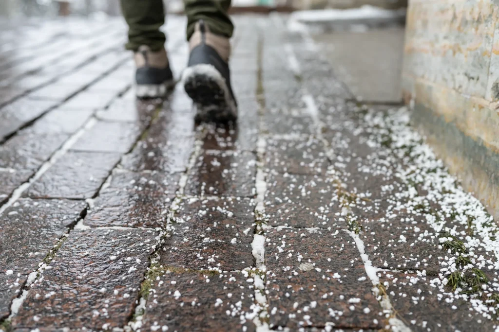 Person walking on icy sidewalk