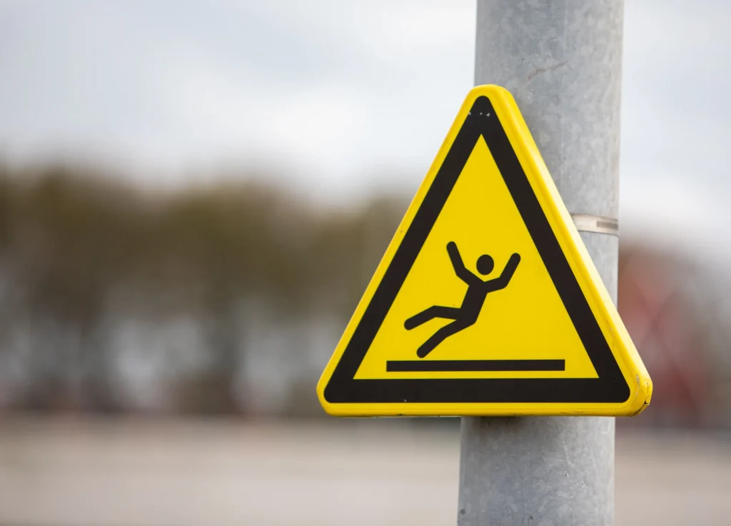 Slippery sign on post