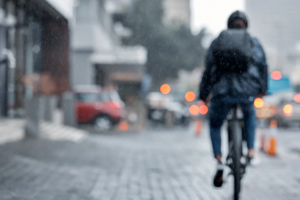 Cyclist riding in the rain
