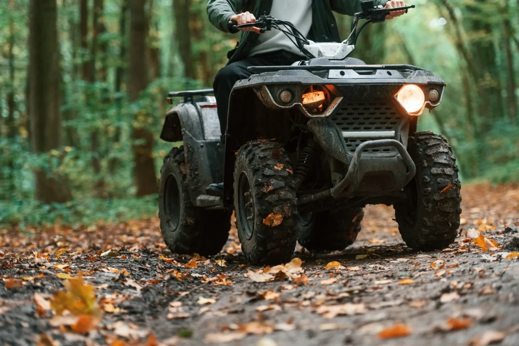 Front view of ATV being driven in a forest