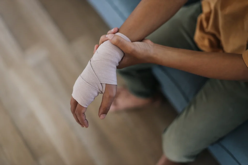 Patient holding sprain, bandage wrist