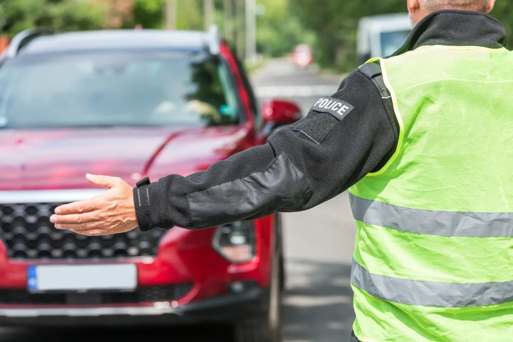 policeman in a reflective vest directing traffic