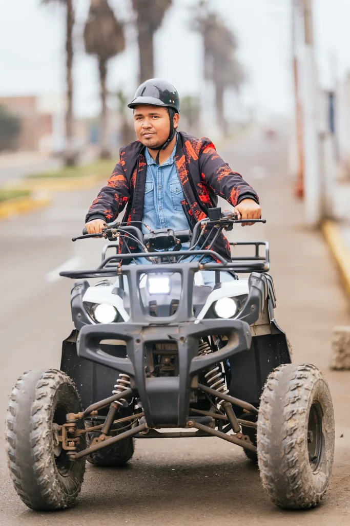 Man driving ATV on city street