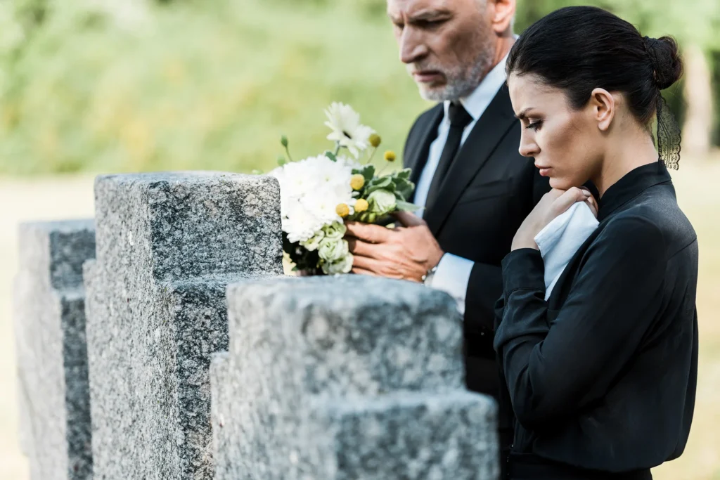 Man and woman at gravesite