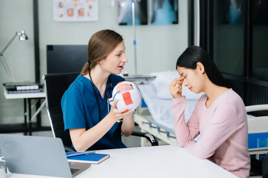 Nurse and doctor discussing brain injury