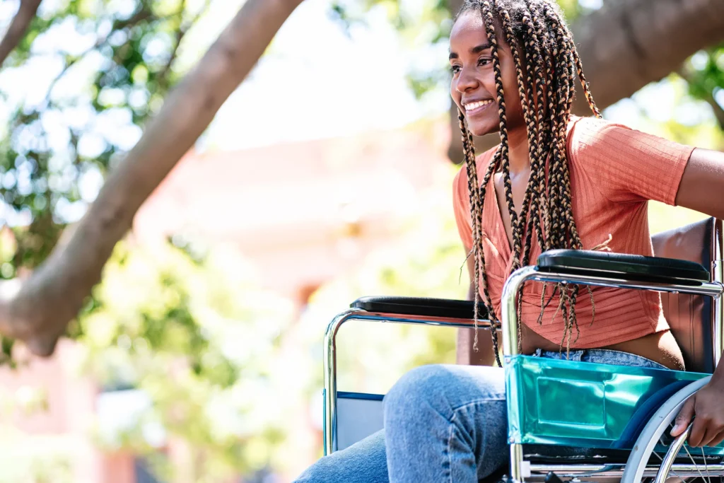 young woman in a wheelchair at the park