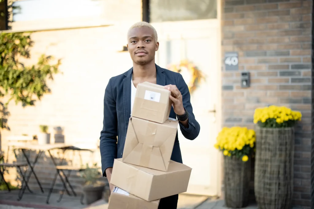 man standing with parcels
