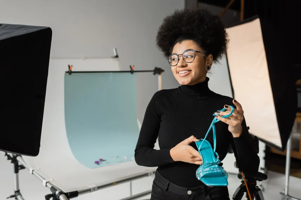 african american woman holding a shoe